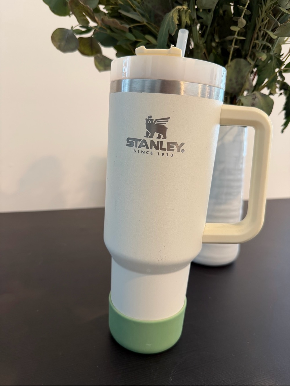 Stanley travel mug with green silicone bottom